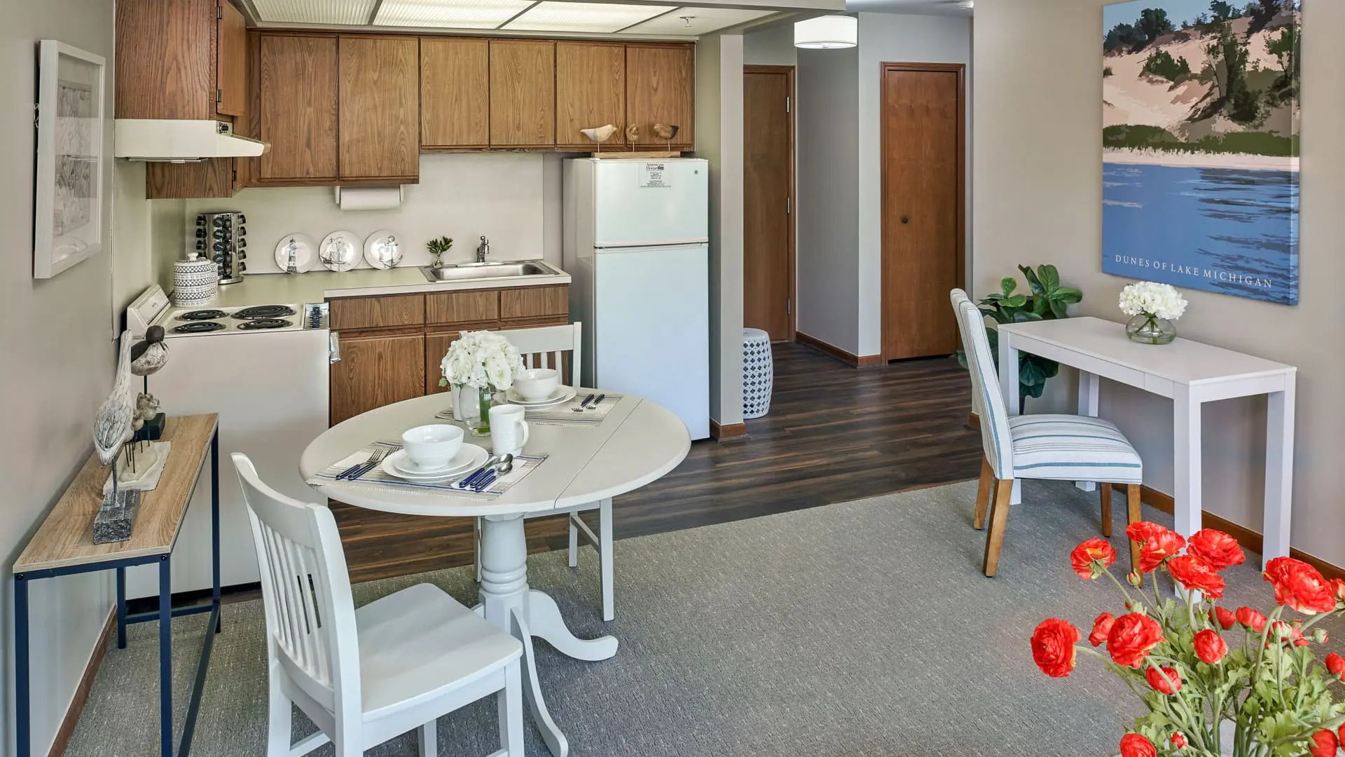 Kitchenette and dining room of a senior apartment at American House East I, a retirement community in Roseville, Michigan